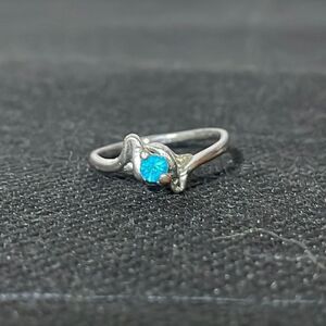 Thin ring with a blue gem